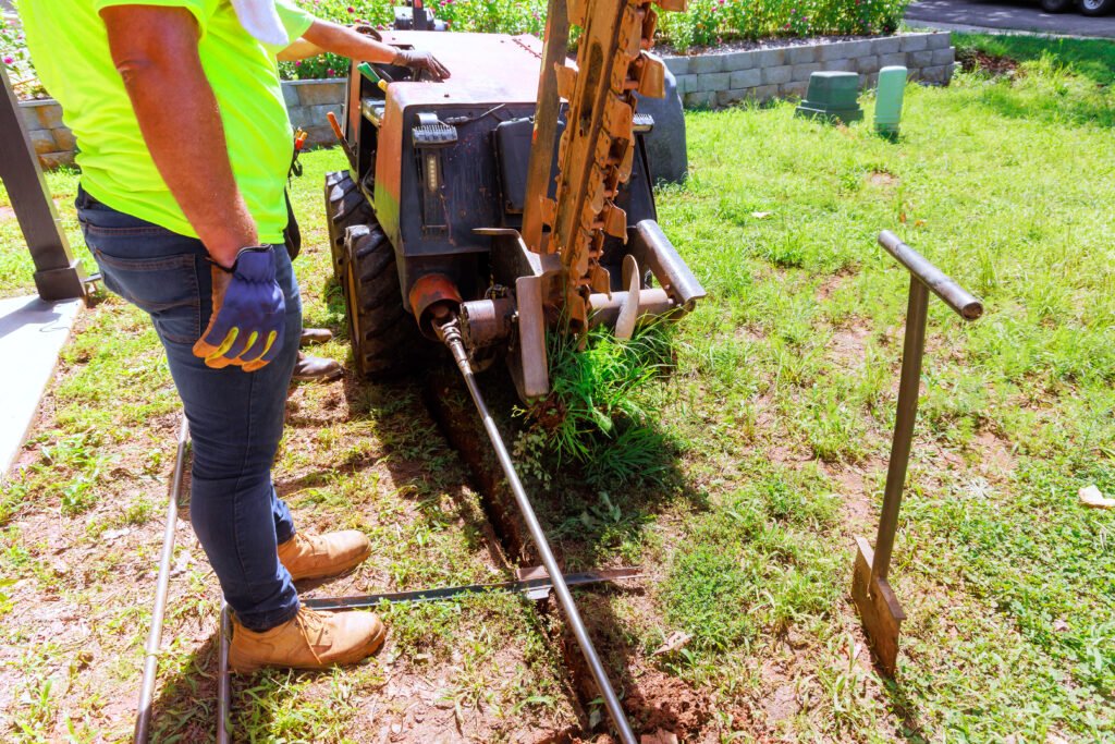 Installing underground communications networks using horizontal directional drilling machines before trenchless laying of a fiber optic cables